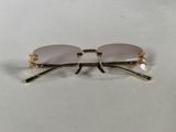 a pair of glasses sitting on top of a table