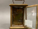 a small clock that is sitting on a table