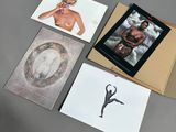 four cards that are sitting on a table