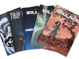 trois livres sont empilés les uns sur les autres devant un fond blanc