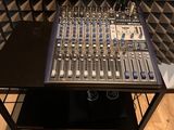 a sound board sitting on top of a table in a recording studio