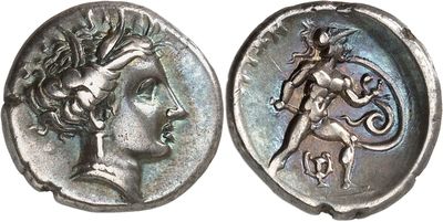 a close up of a coin with an image of a woman on it