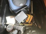 a bin full of cameras and other items in it