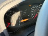 a close up of a car dashboard with a speedometer