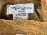 a close up of a label on a jacket that says yves saint laurent