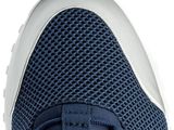 the bottom view of a pair of blue sneakers with white soles