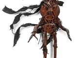 an image of a sculpture of a man made out of wood