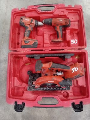 two tools in a red case sitting on the floor