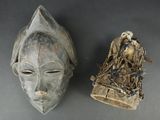 two masks that are sitting next to each other on a table