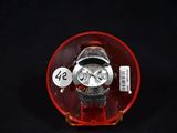 a watch that is sitting in a red case