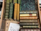 a box full of books sitting on a desk
