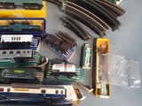 a lot of toy trains on the table together