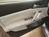 the interior of a car with the door open and the door handle open