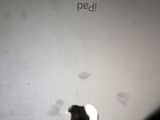 an apple ipad with a hole in the middle of the screen