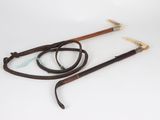 a close up of a pair of canes on a white surface