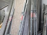 a lot of different types of steel pipes in a warehouse