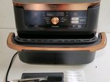 a close up of an air fryer on a counter top