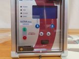 a small machine that is sitting on a wooden table