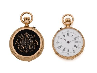 two gold pocket watches with roman numerals and roman numerals on the dial