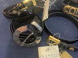 a lot of belts that are sitting on a table