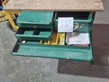 a workbench that has a lot of drawers on it