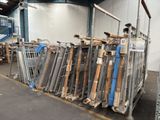 a large pile of metal and wood items in a warehouse