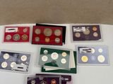 a lot of different coins in a box on a table