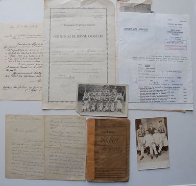 many old papers on the table with old photos
