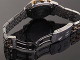 an image of a close up of a wrist watch on a reflective surface