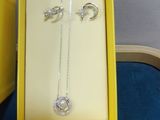a yellow box that has a pair of jewelry in it