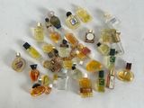 a lot of small bottles of perfume on a table