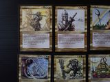 four different cards of different characters are displayed on a table