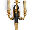 an image of a wall sconce with candles on it