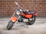 a motorcycle that is parked in front of a brick wall
