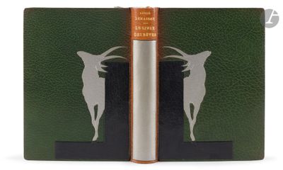 a green book with a picture of a goat on it
