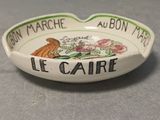 a small bowl with a sign on it that says le caire