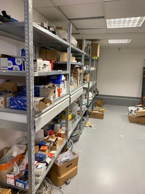 a room filled with lots of boxes and boxes on the shelves