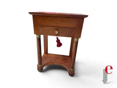 a small wooden table with a drawer on top of it
