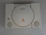 a sony playstation game console sitting on a table