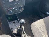 a car dashboard with a gear box and a steering wheel