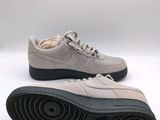 the nike air force 1 low is a light grey color with black soles