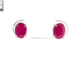 a pair of pink stone stud earrings on a white background