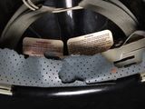 a close up of a helmet with a tag attached to it