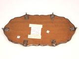 a wooden plaque with writing on it on the wall