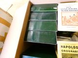many books in a box on the floor