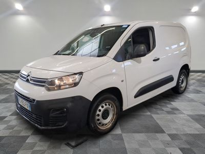 the white van is parked on a checkered floor in a room