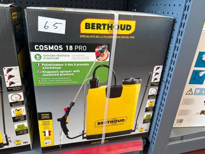 a box with a spray gun on it in a store