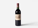 a bottle of wine that is sitting on a table
