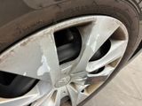 a close up of a tire on a car with a sticker on it