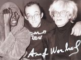 black and white photograph of three men in hoodies posing for a picture